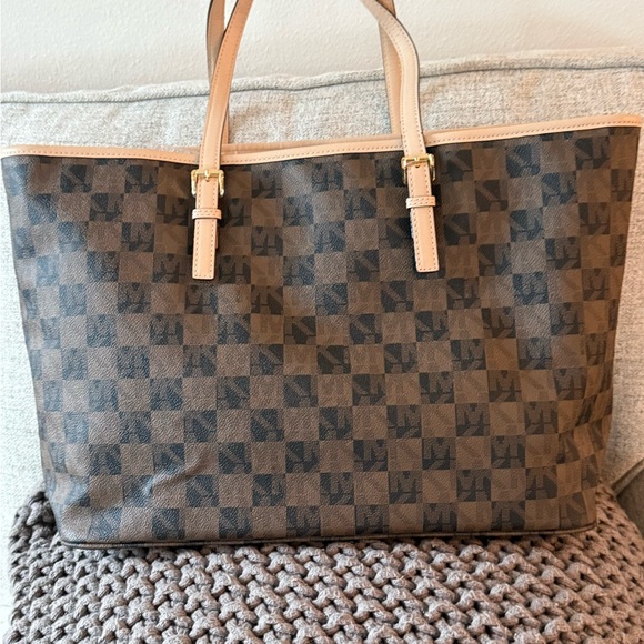 MICHAEL Michael Kors Jet Set travel tote in a brown checkered monogram pattern. - Picture 3 of 7